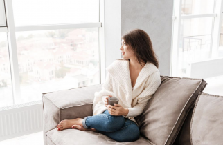 Smiling Woman Sitting on a Couch